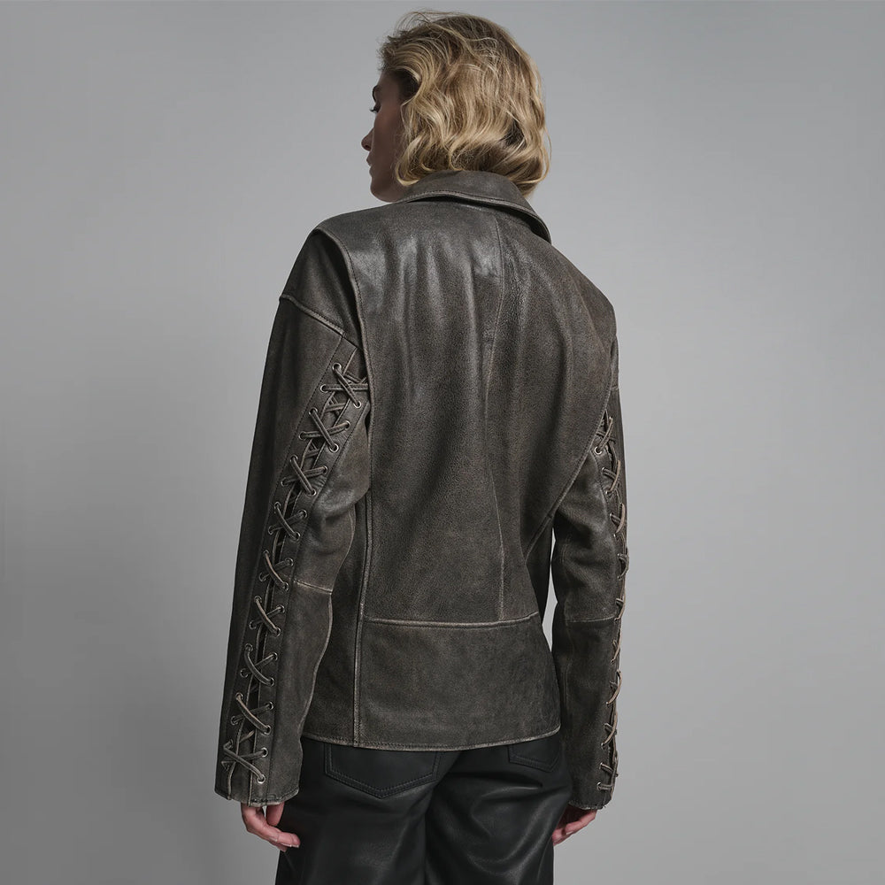 Rear view of distressed leather biker jacket featuring lace-up sleeve details and relaxed fit back yoke.
