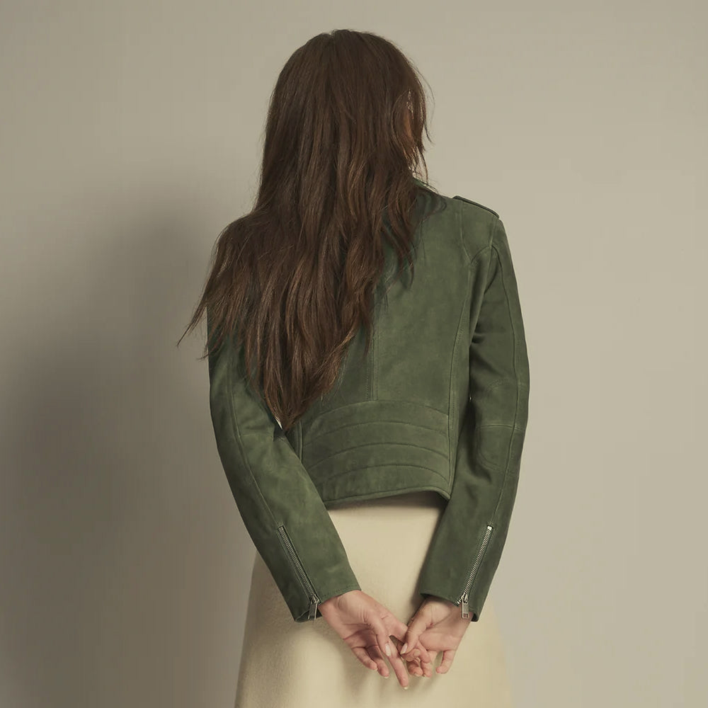 Back view of an olive goat suede moto jacket with vertical contour seams, curved waist quilting and zip cuffs.