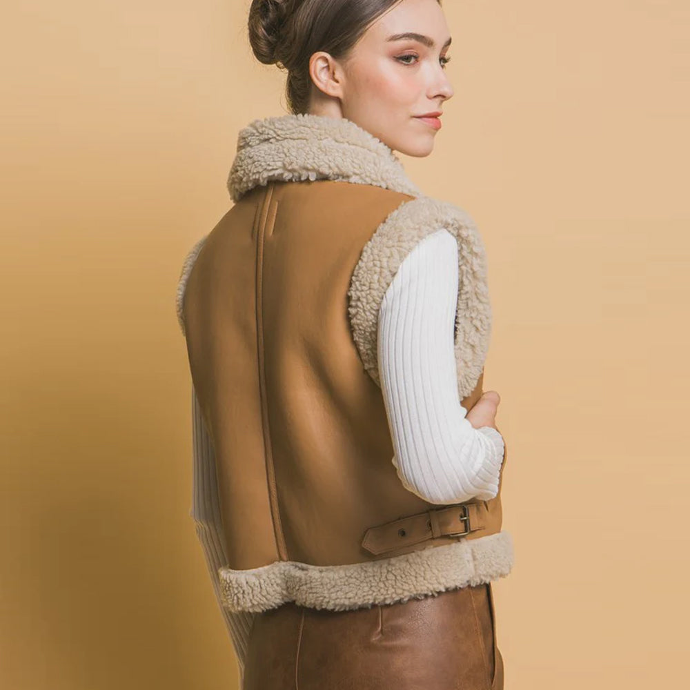 Back view of women's sheepskin leather shearling vest with adjustable belt