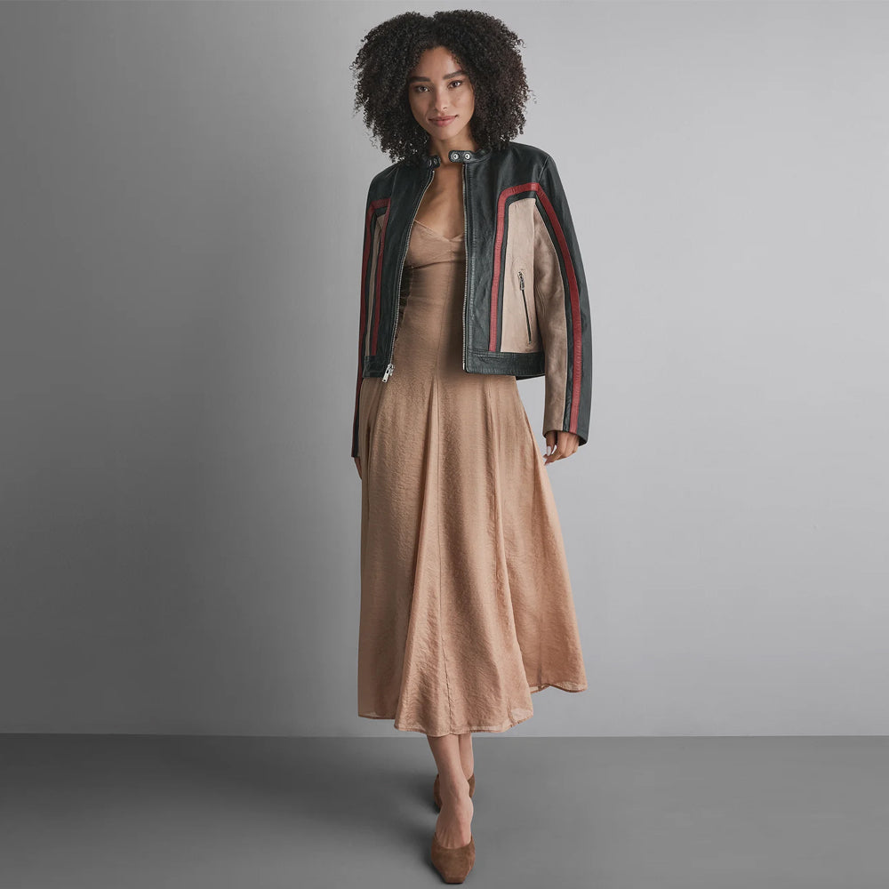 Full-length styling of women’s genuine leather racer jacket with fitted dress and below-waist silhouette