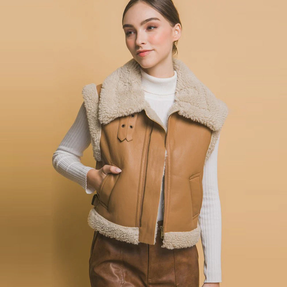 Women's tan sheepskin leather vest with shearling trim, front view